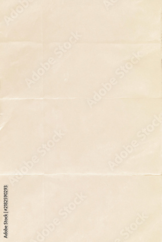 Soft cream paper sheet with visible horizontal and vertical fold lines forms a subtle wrinkled texture and neutral minimalist background.