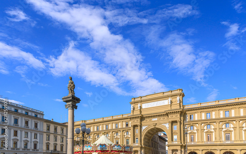 Glimpse of the Republic Square in Florence, Italy: view the Palazzo dell'Arcone di Piazza palace with the Column of Abundance to the rigth.