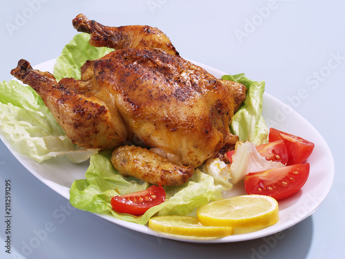 Roast chicken with vegetables and tomato