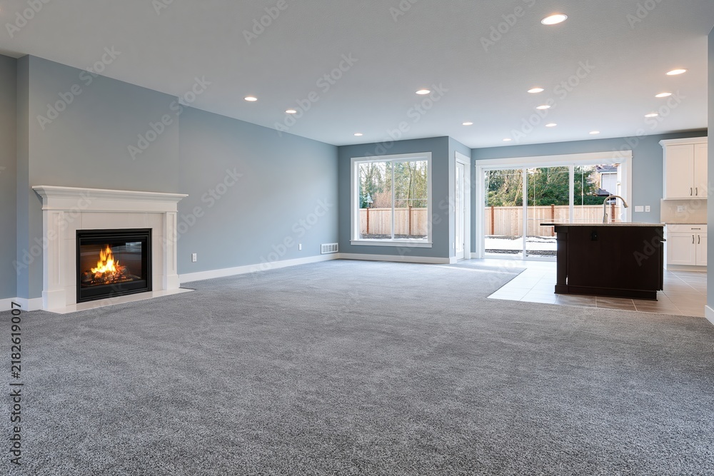 Obraz premium The Fireplace Creates Cozy Focal Point in a Modern Open Concept Living Space