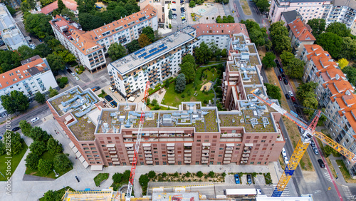 фотографія View of city buildings and construction site from above in a lively urban area