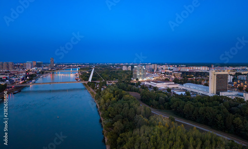Photography Danube river and illuminated city skyline of Bratislava at night