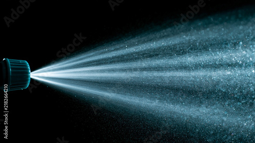 Water mist spray nozzle discharging fine water droplets against a black background