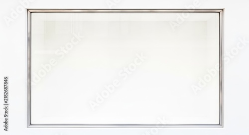 A minimalist empty storefront display window featuring a pristine clean white background and sleek metal frame, perfect for retail mockups, property, retail, entrance