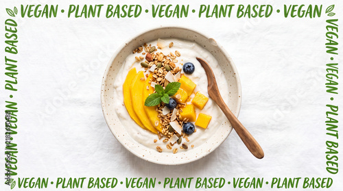 Vegan coconut yogurt with mango and granola in a bowl at a bright cafe setting