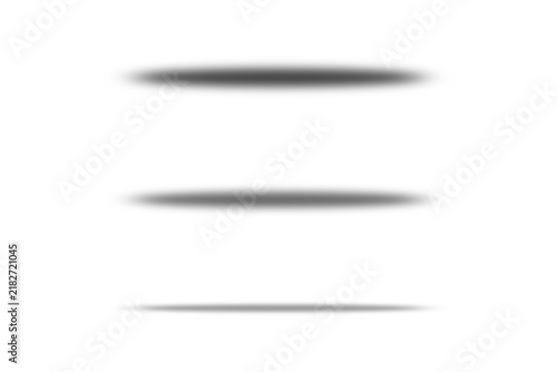 Three black oval shadows isolated on transparent background with soft blurred edges and subtle gradients