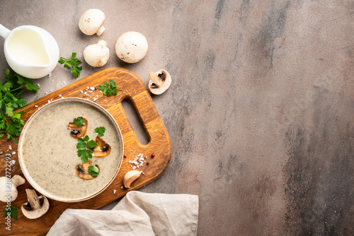 Mushroom soup puree on white kitchen table.