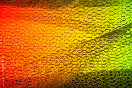 Textured fabric with color gradient symbolizing transition, warm