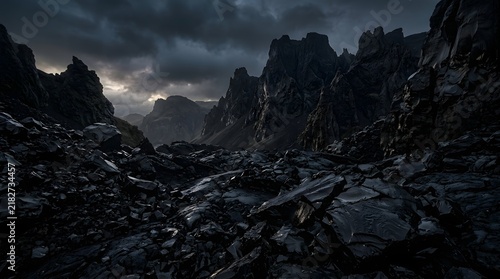 An atmospheric obsidian shadow landscape 4k wallpaper featuring dark jagged volcanic rock formations under a moody and dramatic stormy night sky