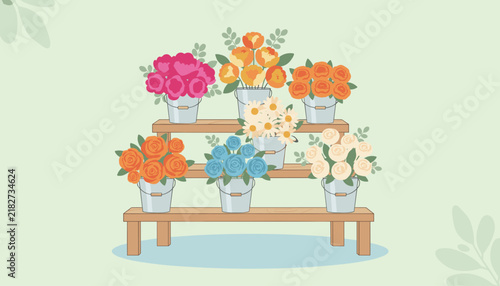 Tiered wooden stand displays several metal buckets filled with colorful flowers like roses, peonies, and bright daisies.