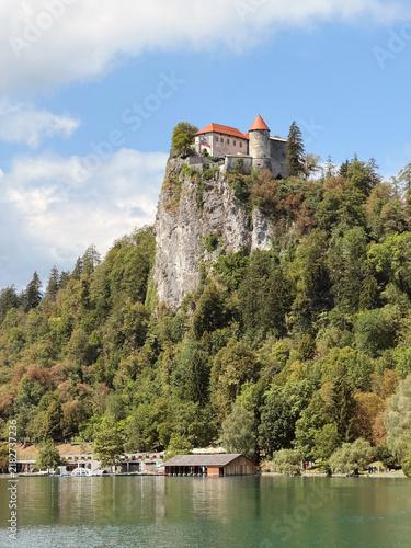 Bled Castle on cliff overlooking Lake Bled, Slovenia, scenic medieval fortress with mountain views
