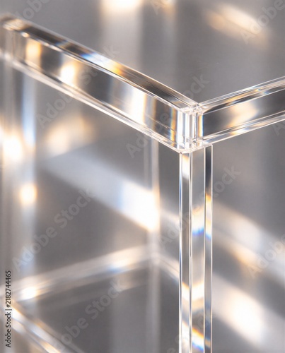 A transparent acrylic display case with prismatic highlights.