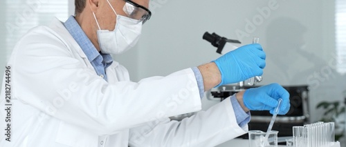 Obraz na płótnie Conducting precise liquid transfers with a pipette into a test tube, the scienti