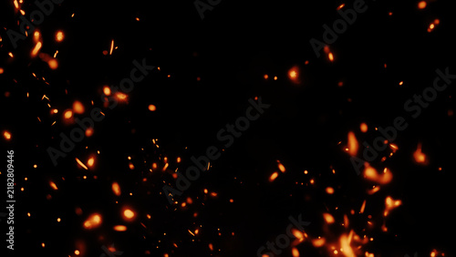 Obraz na płótnie Fiery sparks illuminating a dark background in a dramatic close-up scene of glowing fire particles and embers