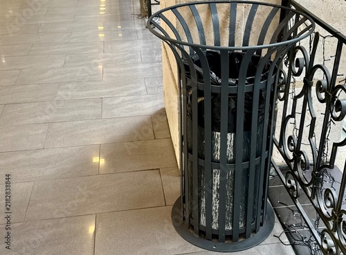 A trash can in a shopping center