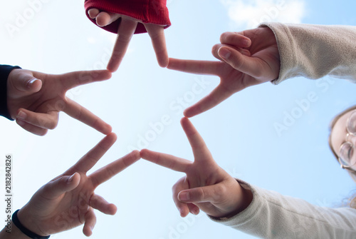 children clasped their hands and made the star sign