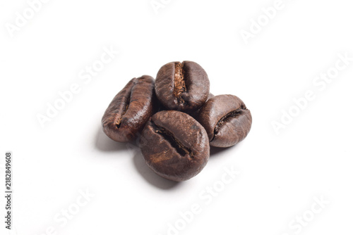 Фотография Close up Macro Shot of Roasted Coffee Beans isolated on a White Background
