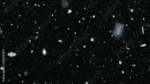 Gentle Snowfall in a Dark Winter Evening with Subtle Twinkling Lights for Festive Backgrounds