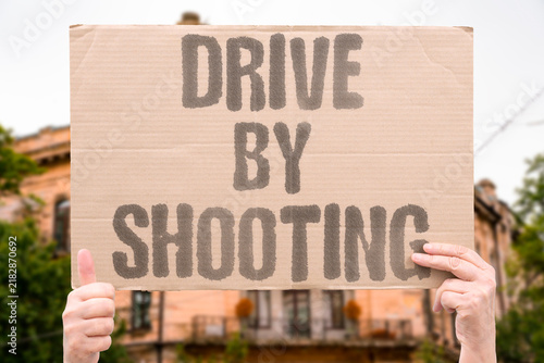Фотография "Drive by shooting" Gunfire discharged from moving vehicle targeting people or location