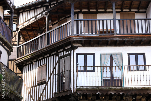 Typical houses with granite stone plinths and upper floors with geometric wooden frameworks and adobe in La Alberca town