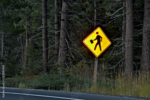 Pedestrian crossing traffic sign modified by adding large mug, a form of “outsider art”