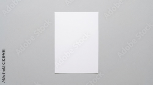 top view empty white paper sheet mockup isolated on minimalist light gray background with copy space