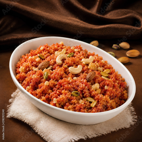 Gajar Halwa With Pistachios and Cashews in a White Serving Dish