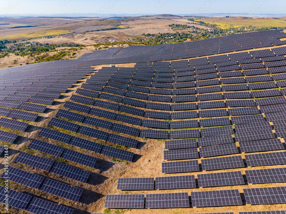 Fototapeta premium Solar panel installation in a rural area generates renewable energy