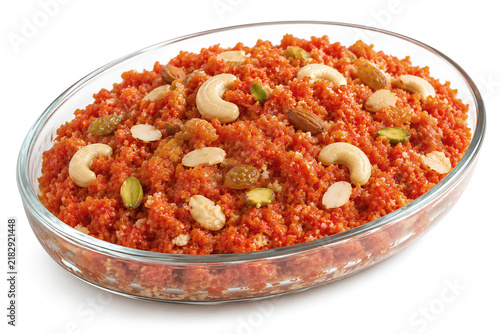 Traditional Carrot Halwa Garnished With Nuts on White Background