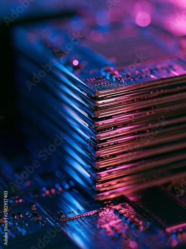 Stack of electronic components, specifically a computer motherboard. the components are arranged in a neat stack, with each component slightly overlapping the one below it.
