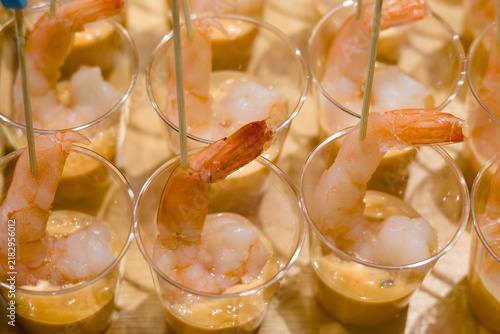 Tom Yum Goong served in a small glass bowl