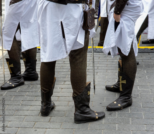 Obraz na plátně Low angle view of medieval knight reenactors showing detailed costumes in a hist