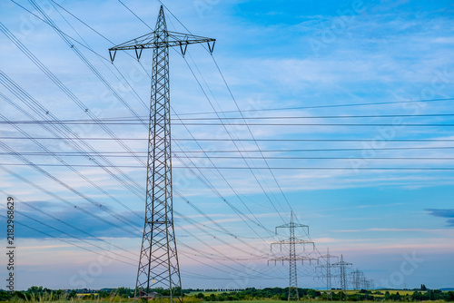 High voltage metal transmission tower, power lines and electricity pylons against sky electrical network, Sustainable energy infrastructure and power supply concept, industrial scenery, power station