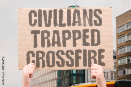 фотографія "Civilians trapped crossfire" Innocents caught between opposing forces unable to escape