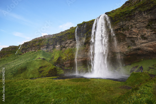Seljalandsfoss waterfall on green cliffs