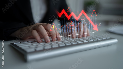 Konstfotografi Economic caution visualized with fluctuating market graph, alert symbols, and negative data trends