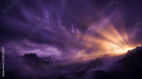 Dramatic purple and orange sky over misty mountains at sunrise photography