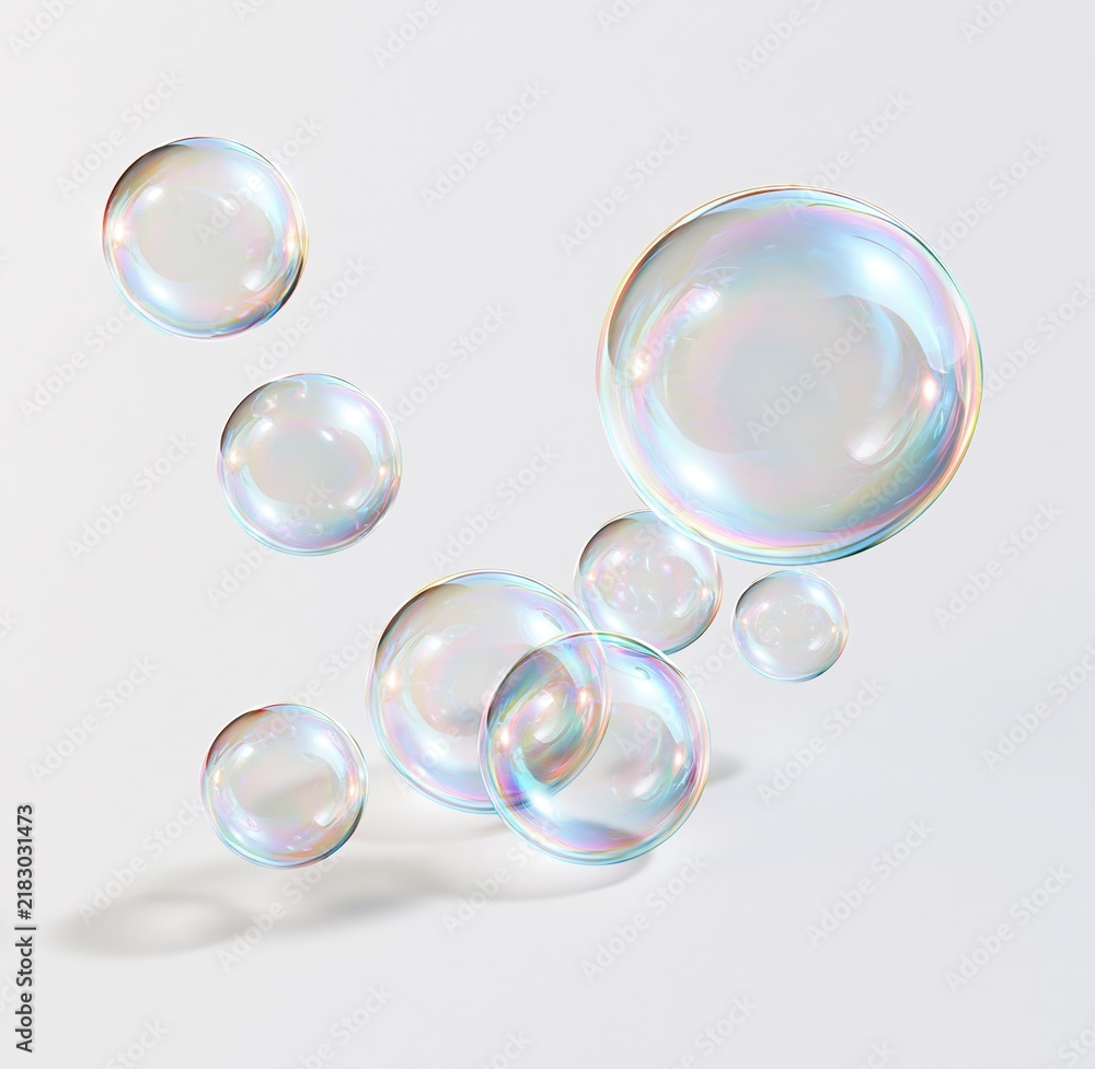 Obraz premium Colorful iridescent soap bubbles floating against white background