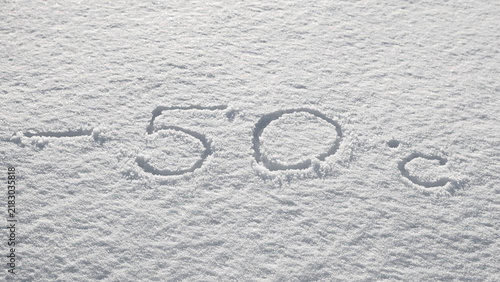 Background with snow, photo of snow texture in winter and numbers indicating that the temperature is -50 degrees Celsius