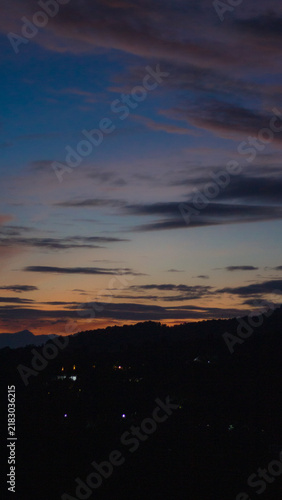Konstfotografi A striking, vertical landscape photograph capturing the serene transition from dusk to night
