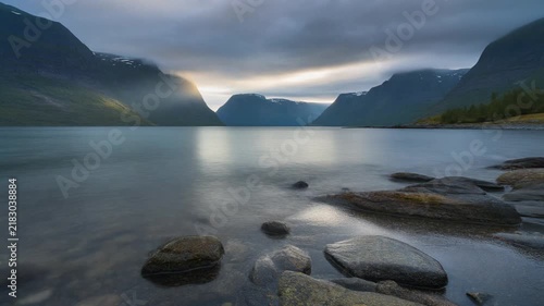 Divine light coastal view of mountain fjord at dawn
