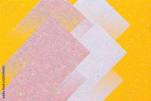 Stacked colored paper sheets on yellow background
