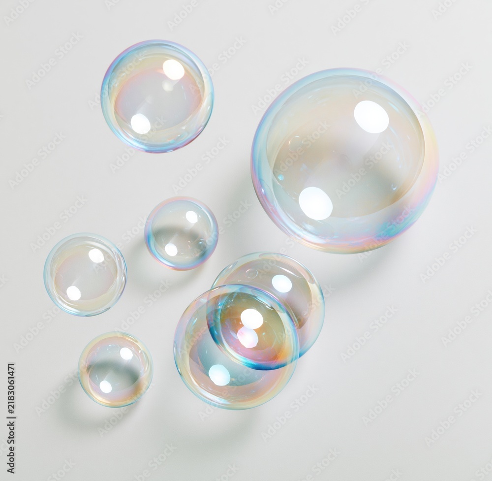 Obraz premium Colorful soap bubbles floating on white background