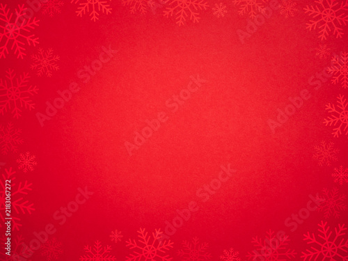 Festive red Christmas background framed with decorative snowflakes and central copy space, ideal for holiday greetings, seasonal promotions, invitations, advertising, banners, and winter campaigns.