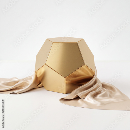 Polished Golden Dodecahedron Draped With Champagne Silk On Minimalist High-Key Studio Background For Luxury Product Display