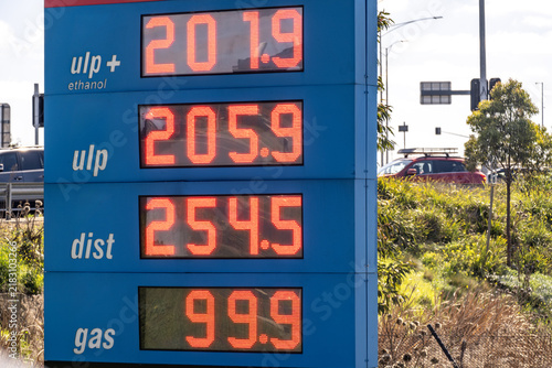 Obraz na plátně A petrol station price board displaying fuel prices in cents per litre for unleaded plus ethanol, unleaded, diesel, and gas in Melbourne, Victoria, Australia, with LED digital numbers