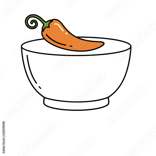 Orange chili pepper in a white bowl