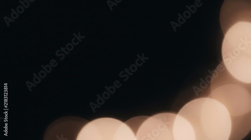 Abstract blurred festive lights on dark background