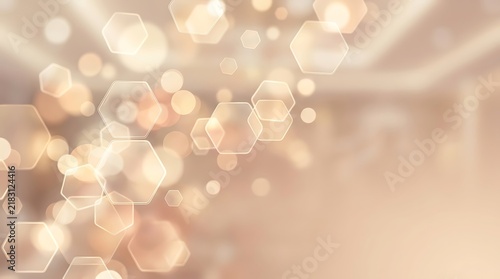 Abstract golden bokeh background with hexagonal light particles