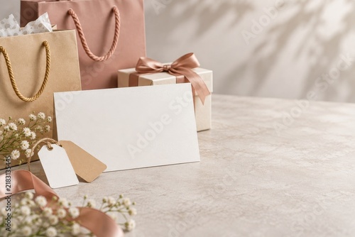 Blank voucher card mockup with price tags and shopping props